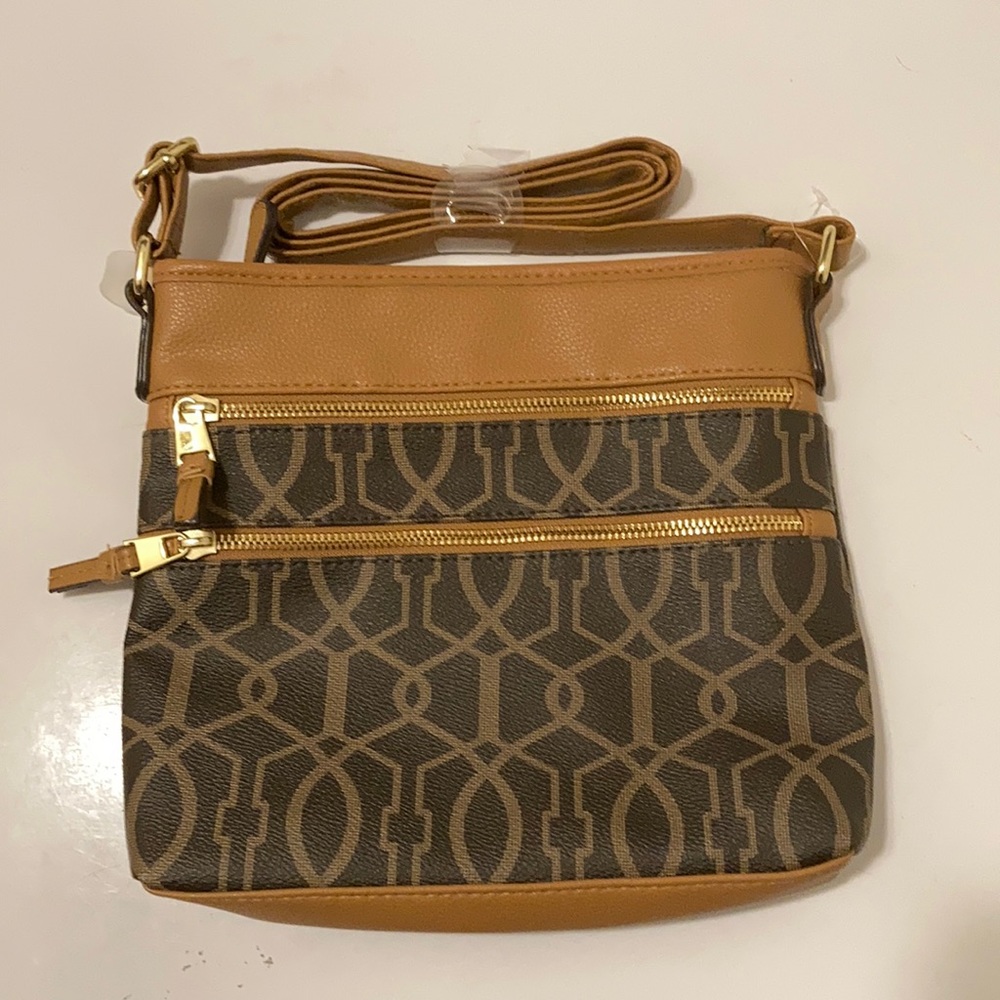 Fashionable brown and tan crossbody bag.